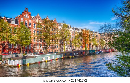 Amsterdam. Wonderful view of city canals and buildings in spring season.