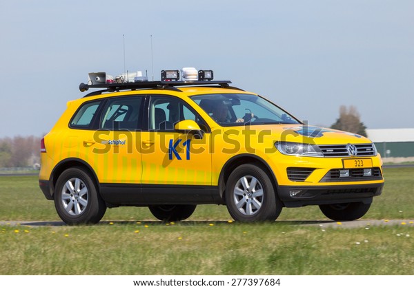 Amsterdam-Schiphol - April 21, 2015: Volkswagen\
Touareg as a Airport Bird Control car at Schiphol airport. These\
cars are equipped with tools to scare birds away and prevent\
aircraft bird\
strikes.