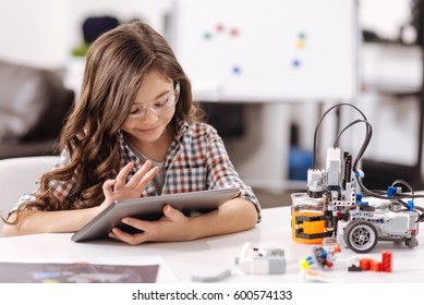 Amused Teen Girl Using Tablet In The Science Studio