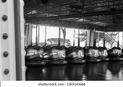 Amusement park bumper cars in a line.