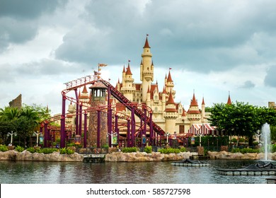 amusement park , Amusement park rides with a very blue sky as background  , beautiful castle and roller coaster in Universal studio - Shutterstock ID 585727598