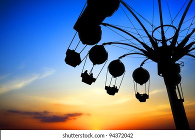 Amusement Park At Sunset