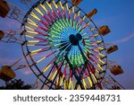 Amusement Rides with Movement Blur in the evening at the local County Fair with copy space  Kentucky, USA, North America