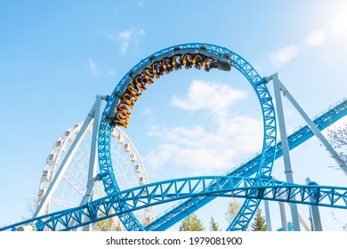 Amusement trolley makes circle loop turns upside down, roller coaster