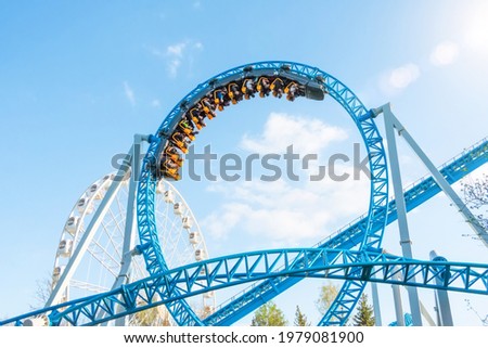 Amusement trolley makes circle loop turns upside down, roller coaster