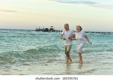 Amusing Elderly Couple Went To The Beach To Have A Walk By Sea