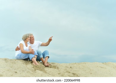 Amusing  happy elderly couple on the beach - Powered by Shutterstock