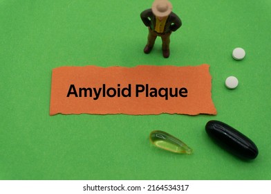 Amyloid Plaque.The Word Is Written On A Slip Of Colored Paper. Health Terms, Health Care Words, Medical Terminology. Wellness Buzzwords. Disease Acronyms.