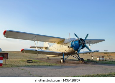An-2, a small propeller sports aircraft at a sports airfield. Termination aircraft for pilot training and parachute jumping on the grass near the runway. Retro old plane. an 2 colt. 
