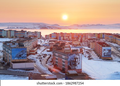 Anadyr, Chukotka, Russia - May 7,2012. Sunrise Over The City Of Anadyr. Morning View Of Colorful Buildings And Sun Over The Horizon. Cold Spring In The Arctic. Anadyr Is The Easternmost City In Russia