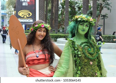 Anaheim, CA / USA - March 23, 2018: Two Young Woman Pose In Their Cosplay Outfits As Moana And Te Fiti During Wondercon