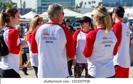 Anaheim, CA / USA - Nov 3, 2019: Volunteer Team Talking Together At The 2019 JDRF One Walk Fundraiser. Event Raises Funds For Research To Find A Cure For Type 1 Diabetes. Background Defocused.