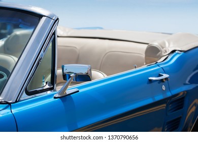 Anaheim, California - April 14, 2019: A classic convertible mustang with white interior and top down in pristine condition at fabulous fords forever auto show.