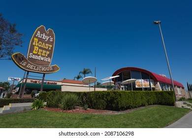 Anaheim, California - March 28, 2020: A historic Arby's roast beef neon sign and the original Conestoga wagon style building.