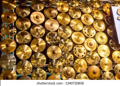 Anaheim, California/United States - 01/26/18: A Wall Of Golden Crash Cymbals By The Brand Sabian At The NAMM Show 2018