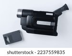 Analog camcorder standard VHS and video cassette. White background. View from above.