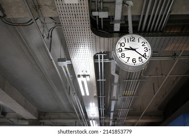 Analog Clock Hanging on Ceiling.