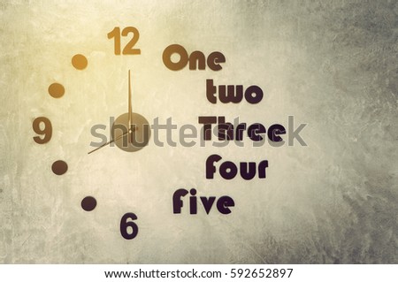 analog clock on cement wall