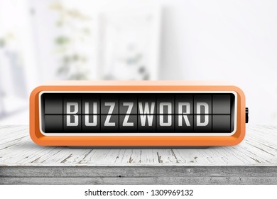 Analog device with the text buzzword on a wooden table in a bright living room