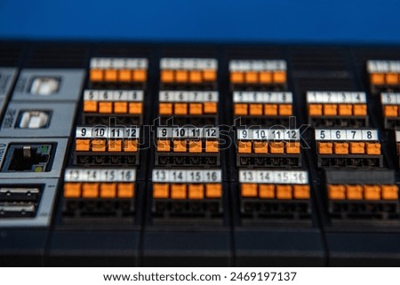 Analog and digital inputs of the Programmable Logic Controller PLC. Selective focus.