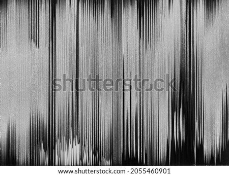 Analog glitch texture. Distressed overlay. Old videotape damage. TV signal error. Dark black white bw grain line noise abstract background.