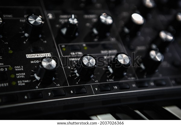 Analog\
synthesizer device. Professional audio equipment for electronic\
music production in sound recording studio.\
