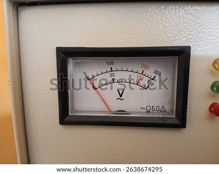 Analog voltmeter displaying voltage, essential for electrical measurements and power systems.