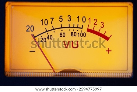 An analog VU meter with red overload led, and -20 to +3 decibel scale. VU meter analog of audio equipment in sound studio