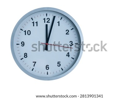 Analog wall clock displaying exactly 12 o'clock on a white background