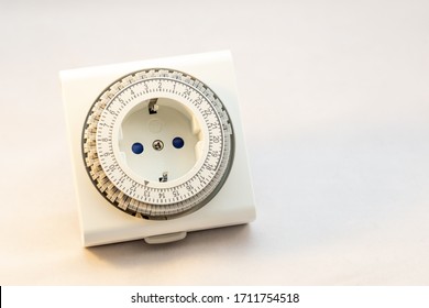 Analogue Timer Switch To Set Your Light On Or Machine On A Certain Moment On A White Background