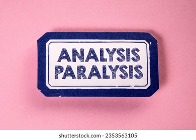 Analysis Paralysis. Sticky note with text on a pink background.