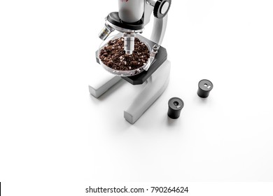 Analysis process. Soil under microscope on white background copy space