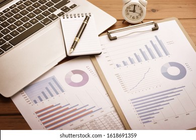 Analysis Scenario Of Financial Data Report Placed On The Desk