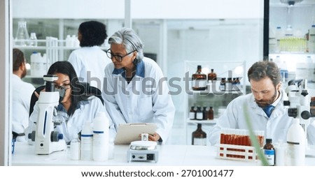 Analysis, science or people with microscope in lab, blood sample trial or experiment for pathology. Medical research, study chemical reaction or scientist with project file, coworking or test results