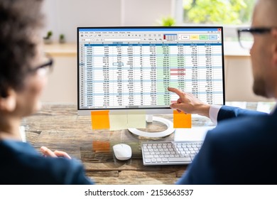 Analyst Employee Working On Spreadsheet Using Desktop Computer