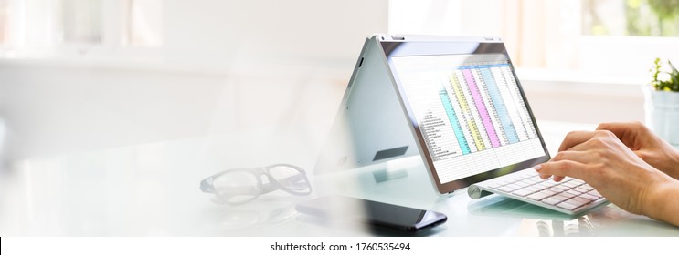 Analyst Employee Working With Spreadsheet On Computer Screen