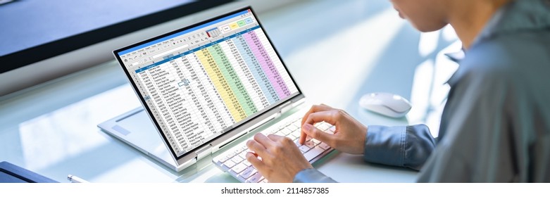 Analyst Employee Working With Spreadsheet On Computer Screen