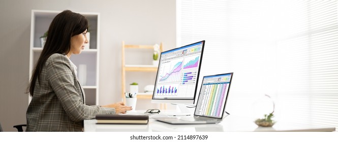 Analyst Employee Working With Spreadsheet On Computer