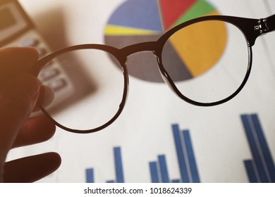  The analyst prepare to wear the eyeglasses. Analyzing financial data.                            