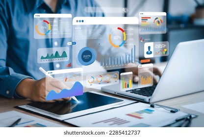 An analyst uses a computer and dashboard for data business analysis and Data Management System with KPI and metrics connected to the database for technology finance, operations, sales, marketing  - Shutterstock ID 2285412737