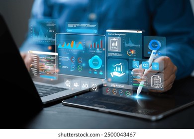 An analyst uses a computer and dashboard for data business analysis and Data Management System, Customers database, gather information to report. Data science technology and digital marketing
