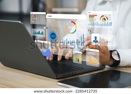 An analyst uses a computer and dashboard for data business analysis and Data Management System with KPI and metrics connected to the database for technology finance, operations, sales, marketing 