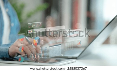 An analyst uses a computer and dashboard for data business analysis and Data Management System with KPI and metrics connected to the database for technology finance, operations, sales, marketing