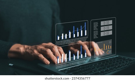 Analyst using computer for business and financial data and information analysis. KPI management in sale operation cost, marketing promotion campaign, account and financial report
