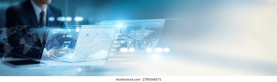 Analyst using laptop enhancing mobile security protocols, device protection, encryption, malware defense, authentication, access control, firewall monitoring, threat detection, and compliance systems.