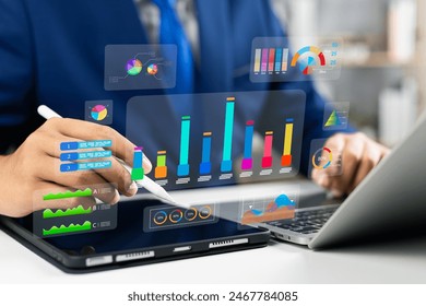 Analyst utilizing technology and dashboard with charts data science and Big Data technology for business, Strategic data management system with KPI organization performance with technology and metrics - Powered by Shutterstock