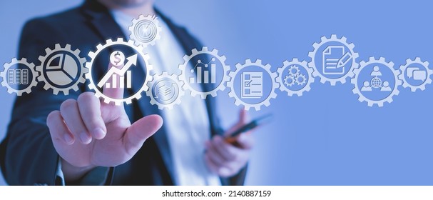 Analyst working with Business Analytics and Data Management System on computer to make report with KPI and metrics connected to database. Corporate strategy for finance, operations, sales, marketing