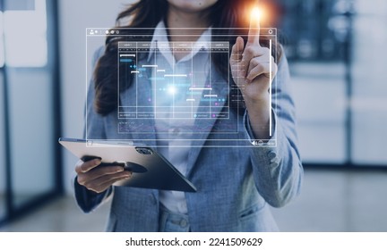 Analyst working with computer in Business Analytics and Data Management System to make report with KPI and metrics connected to database. Corporate strategy for finance, operations, sales, marketing