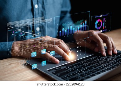 Analyst working with computer in Business Analytics and Data Management System to make report with KPI and metrics connected to database. Corporate strategy for finance, operations, sales, marketing.