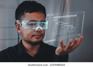 Analyst working with computer in Business Analytics and Data Management System to make report with KPI and metrics connected to database. Corporate strategy for finance, operations, sales, marketing.